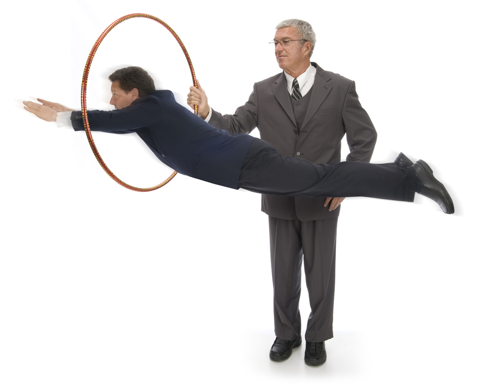 Man jumping through a hoop.